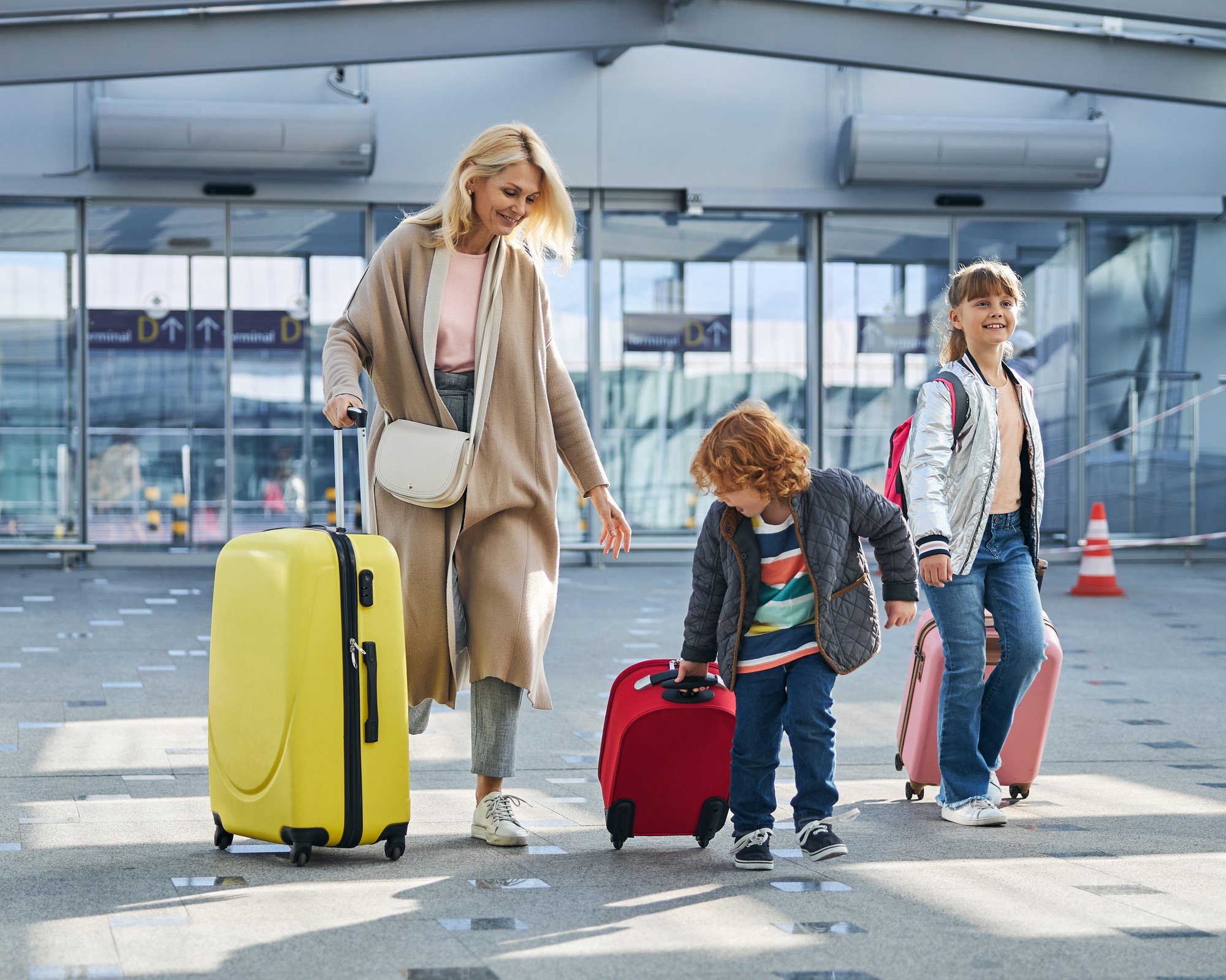 happy-family-moving-at-the-airport-hall-2023-11-27-04-55-07-utc